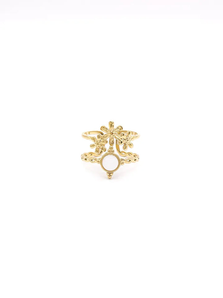 Bague dorée florale ouverte avec pierre blanche