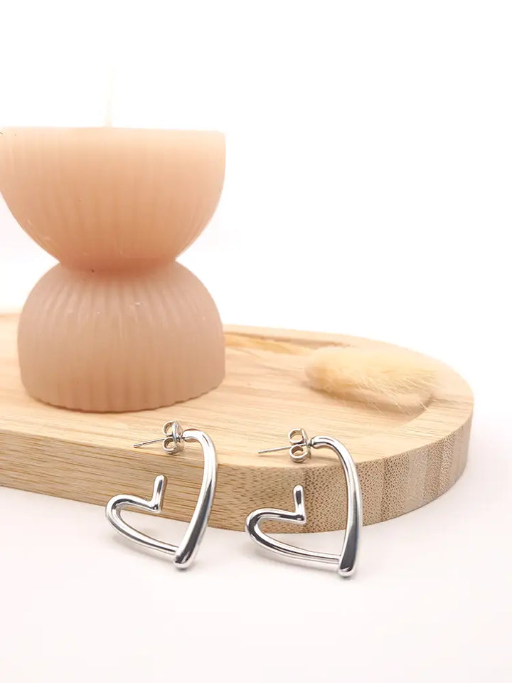 Boucles argentées fines acier inoxydable forme cœur