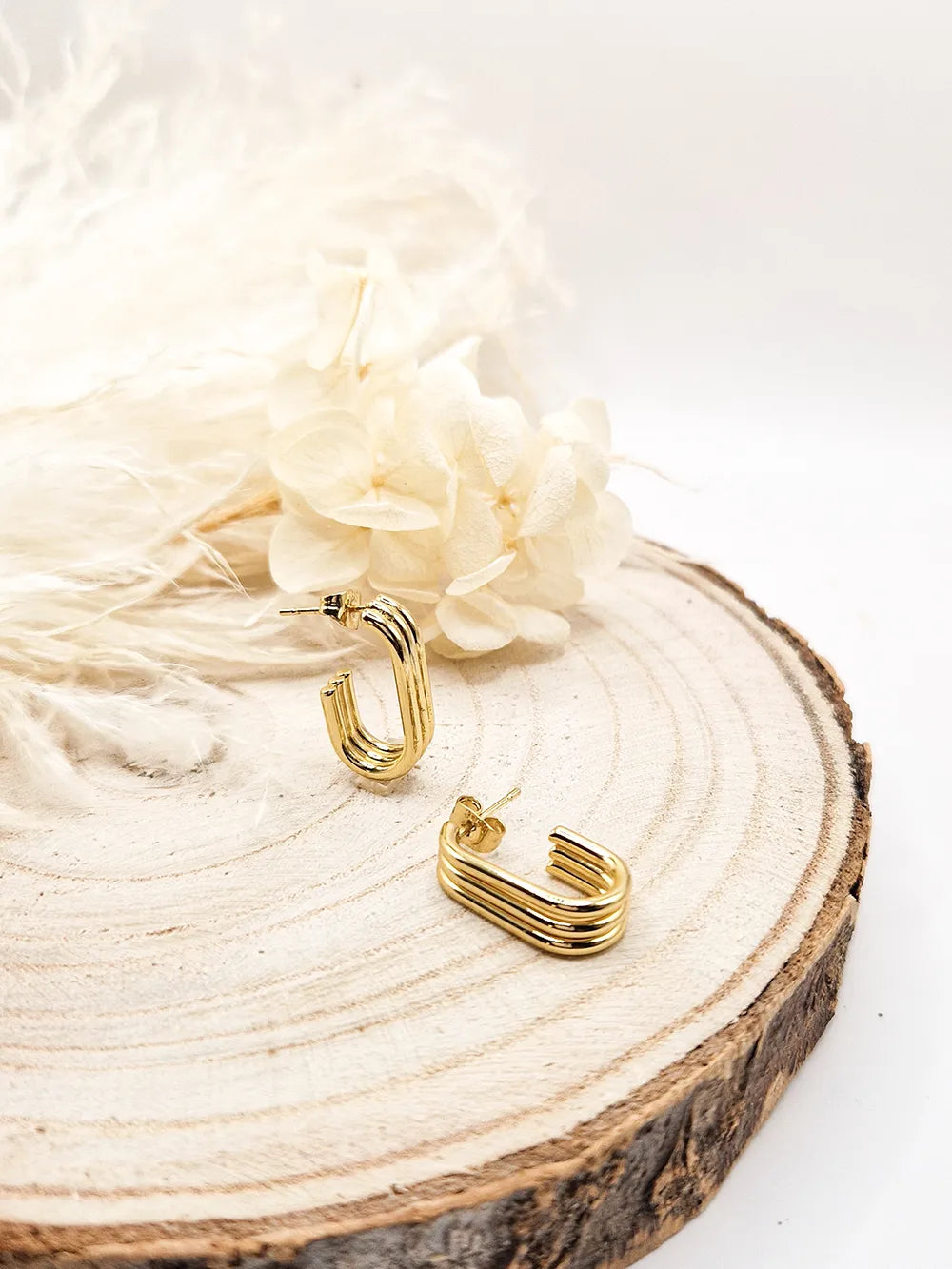 Petites créoles ovales dorées trois stries