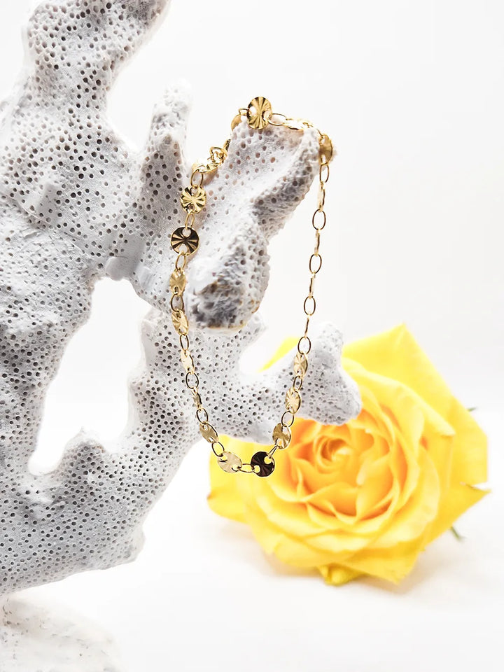 Bracelet doré ajustable médaillons étoilés