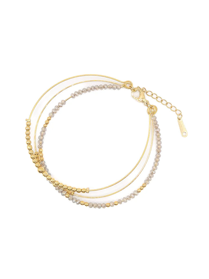 Bracelet triple jonc doré avec perles blanches translucides