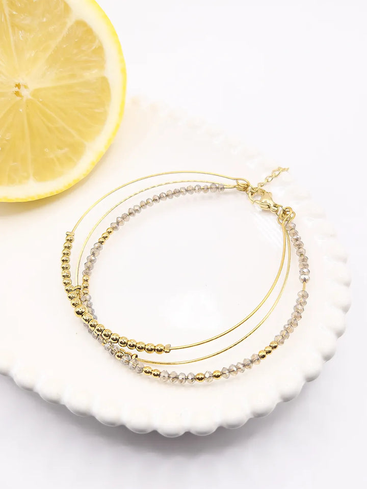 Bracelet femme doré trois joncs semi-rigides perles blanches